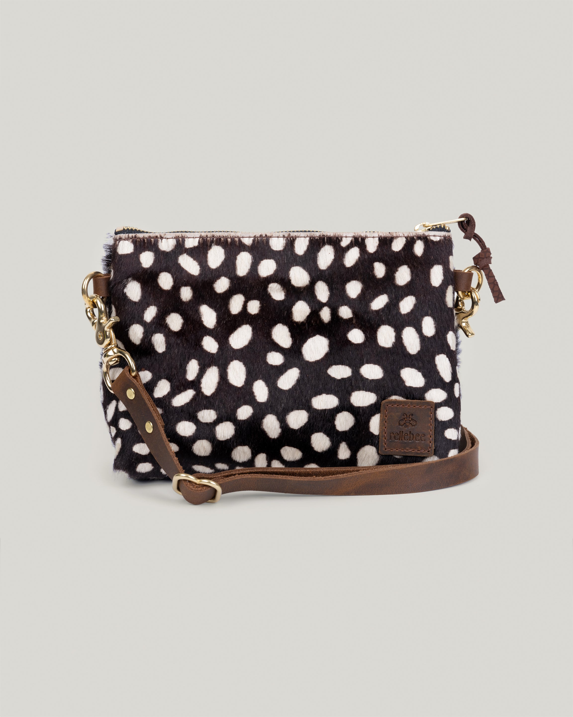 Closeup image of the Little Brooklyn sling in coco dot hair on hide