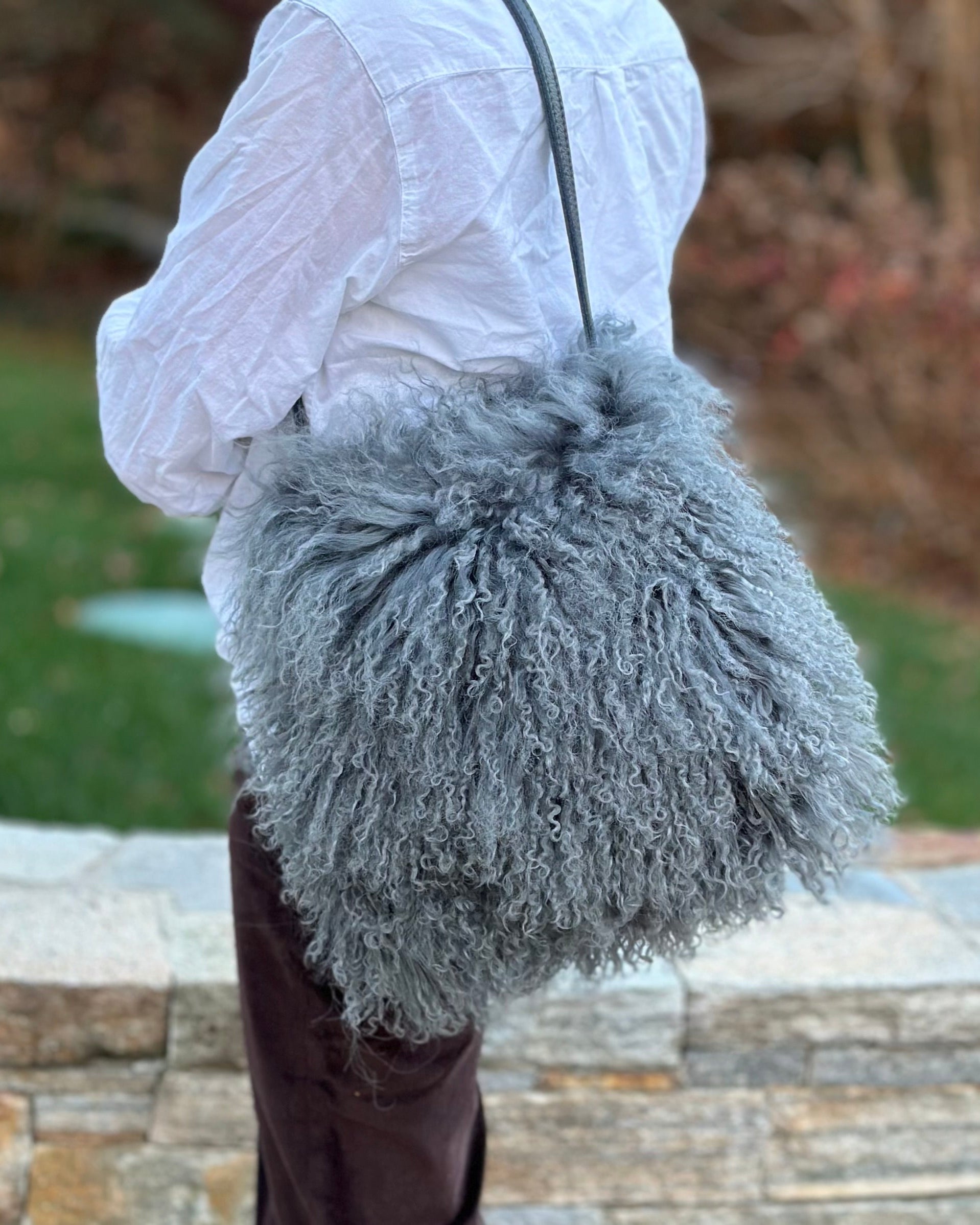 Side view image of model wearing the Mongolian in Dove Grey (lined)