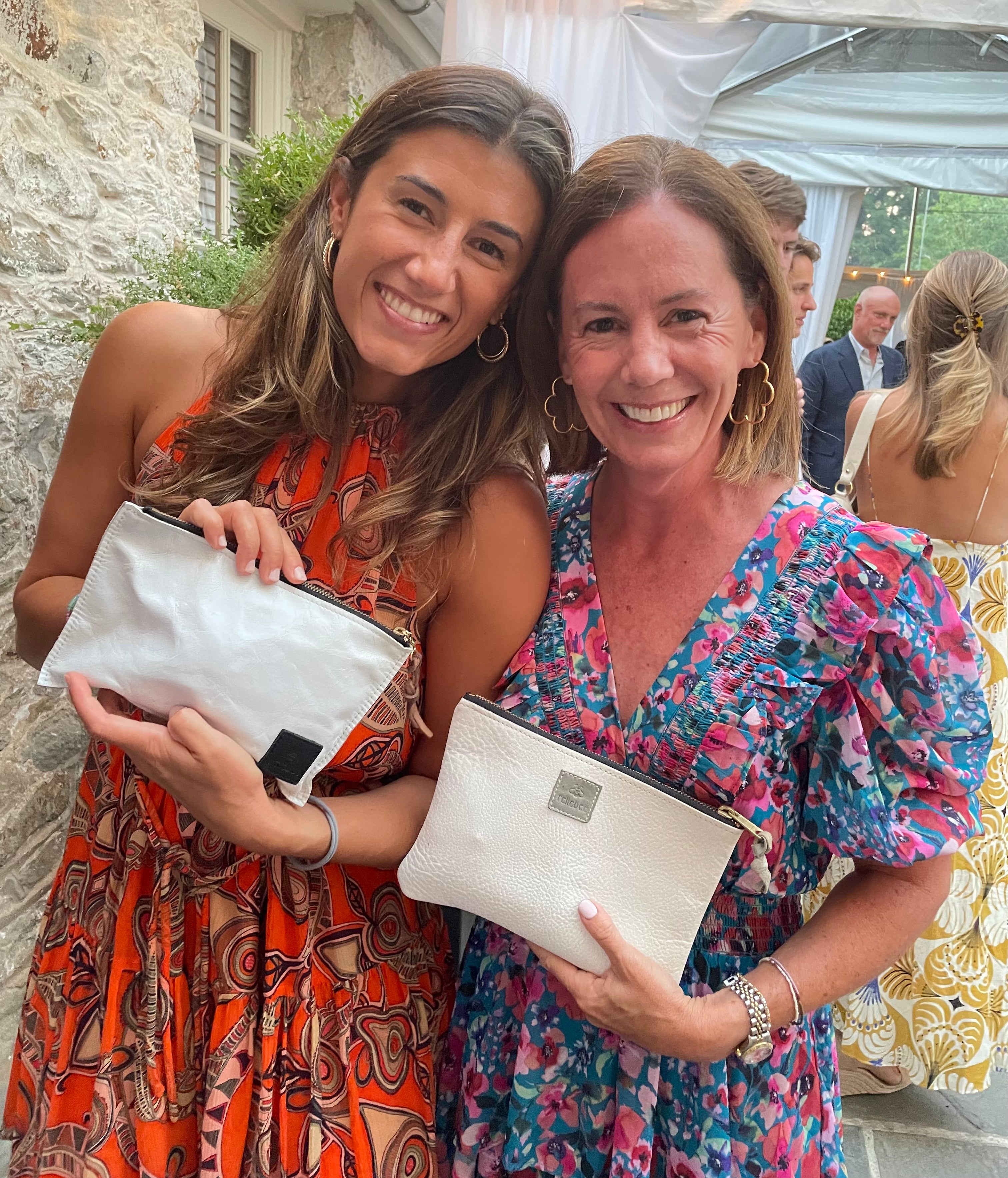 Image of two models showing the clutch in oat milk