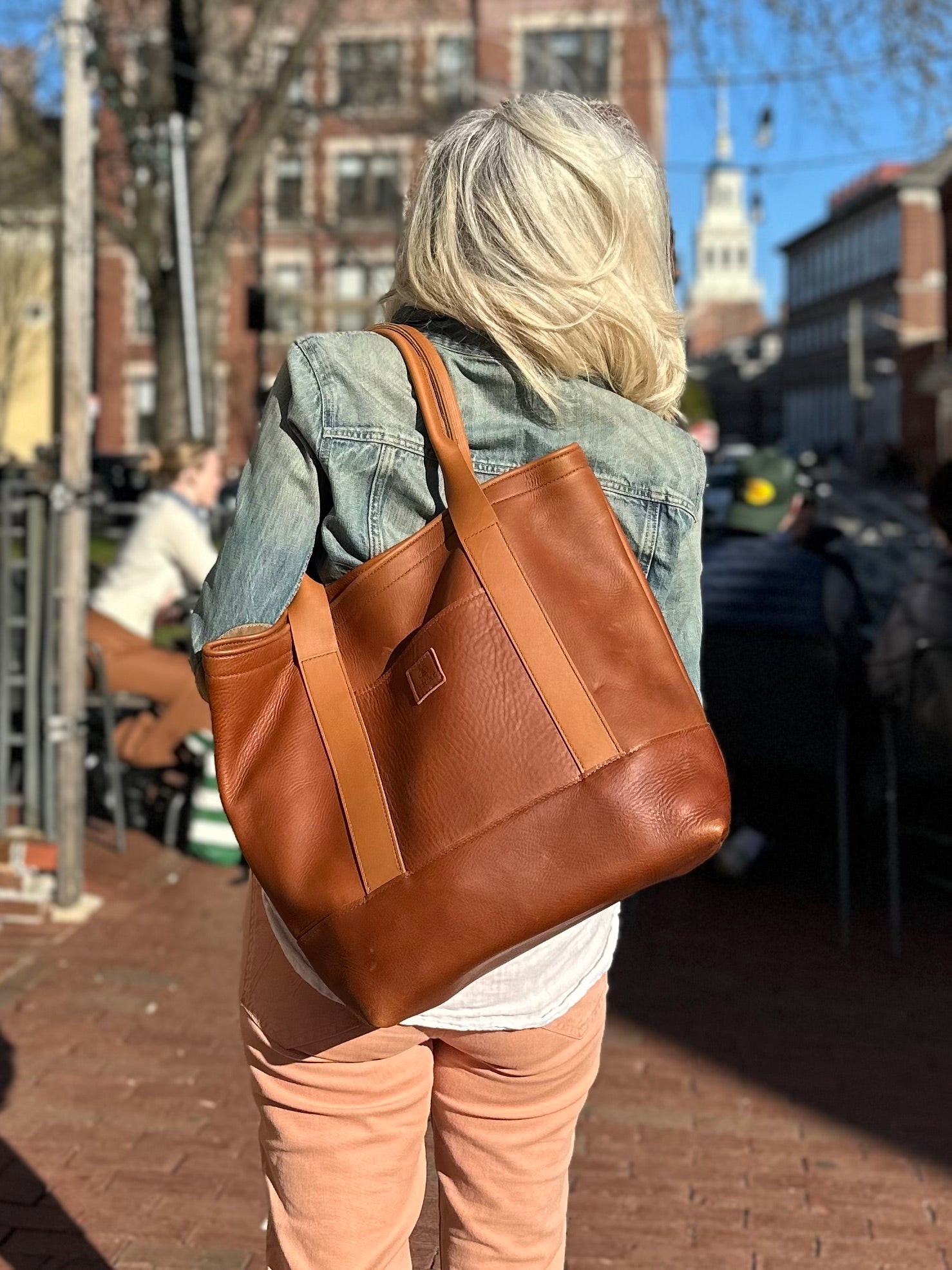 Honey leather handle detail and stitching on Rellebee Berkshire leather tote