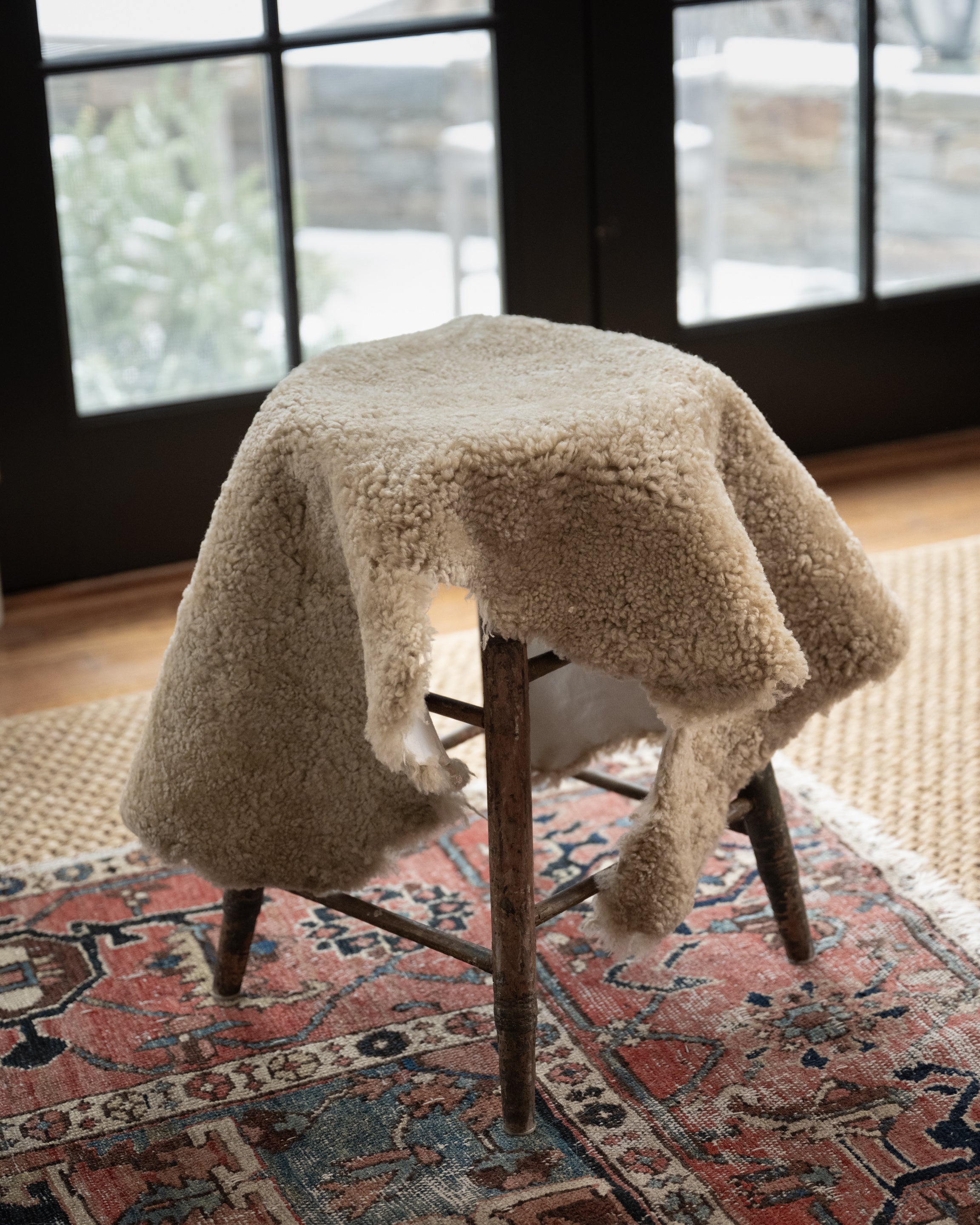 Image of product New Zealand Sheepskin in Natural color on a stool