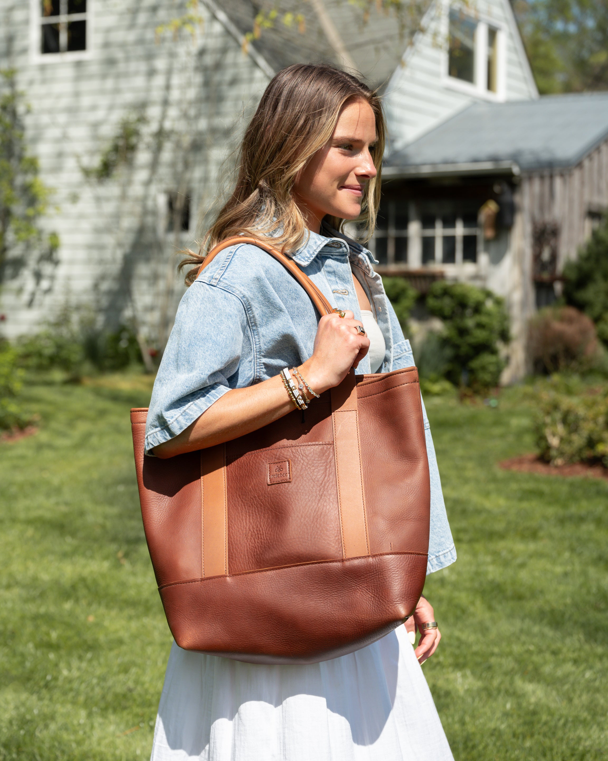 Honey leather handle detail and stitching on Rellebee Berkshire leather tote
