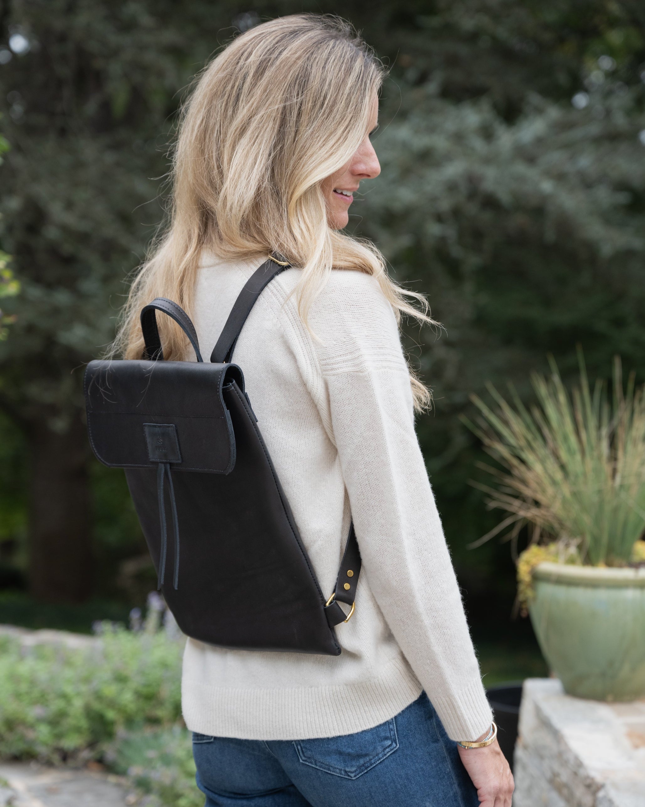 Image of Model wearing the product Messenger Pack in Jet Black.