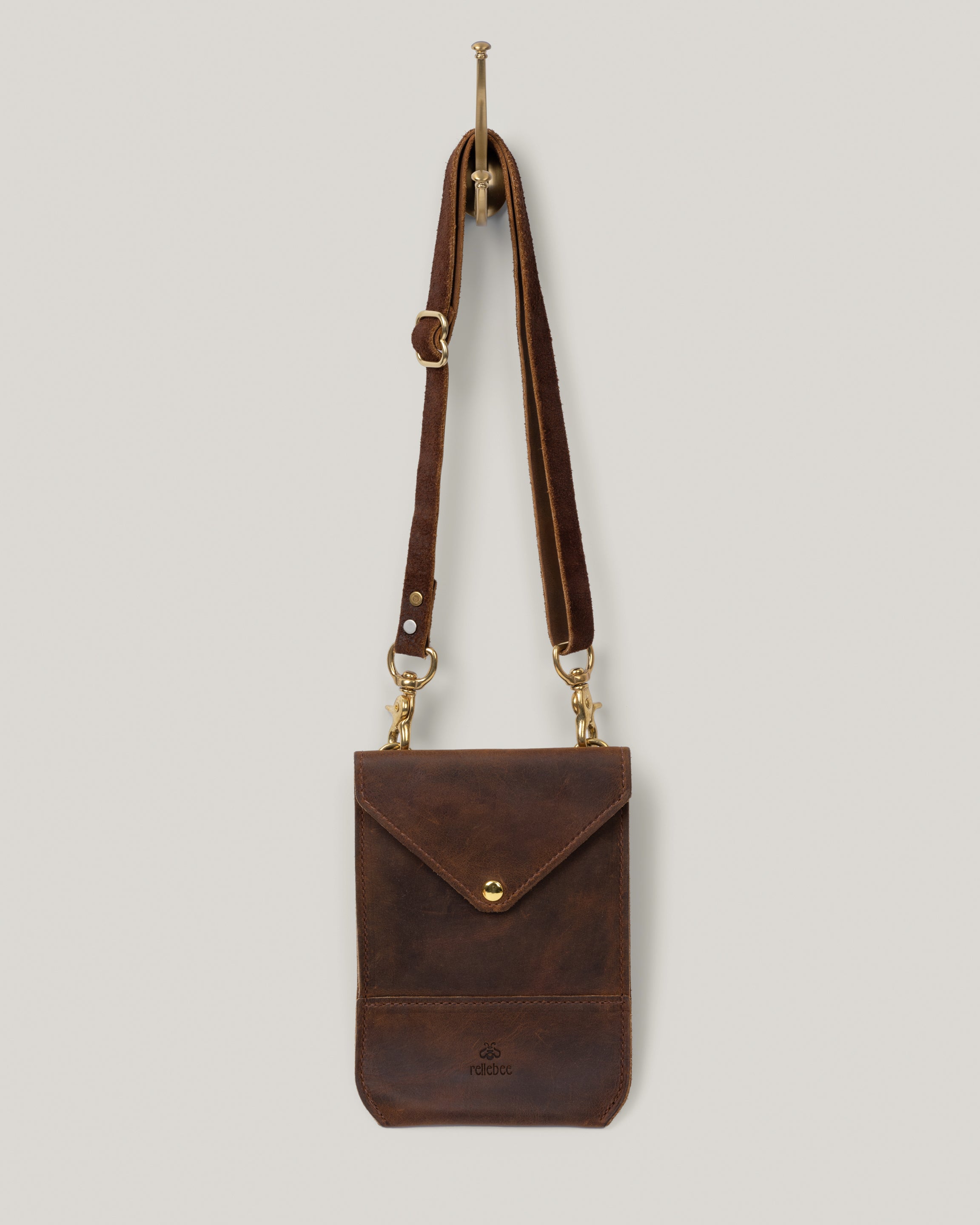 Image of the Envelope sling hanging from wall hook