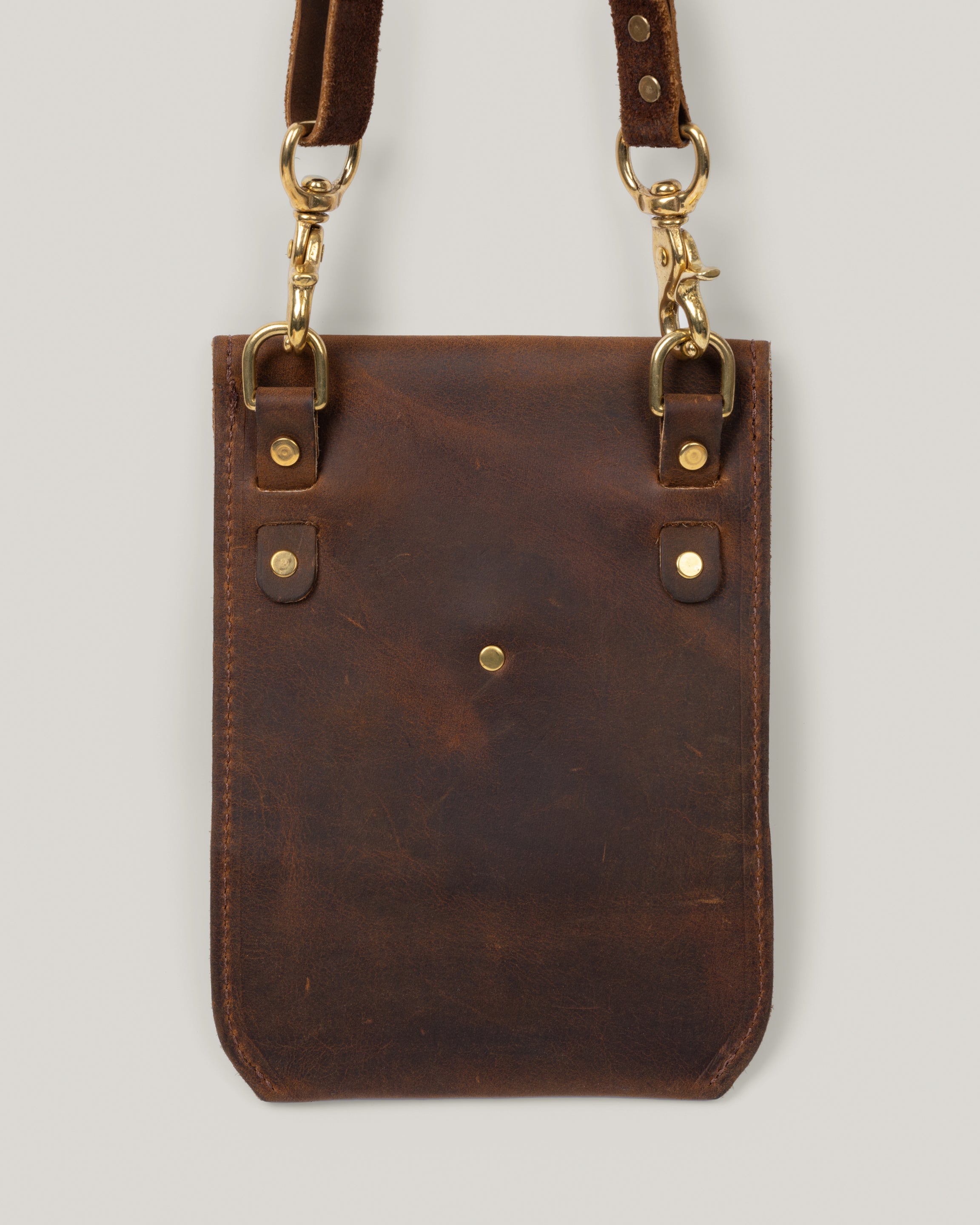 Back view Image of the Envelope sling hanging from wall hook