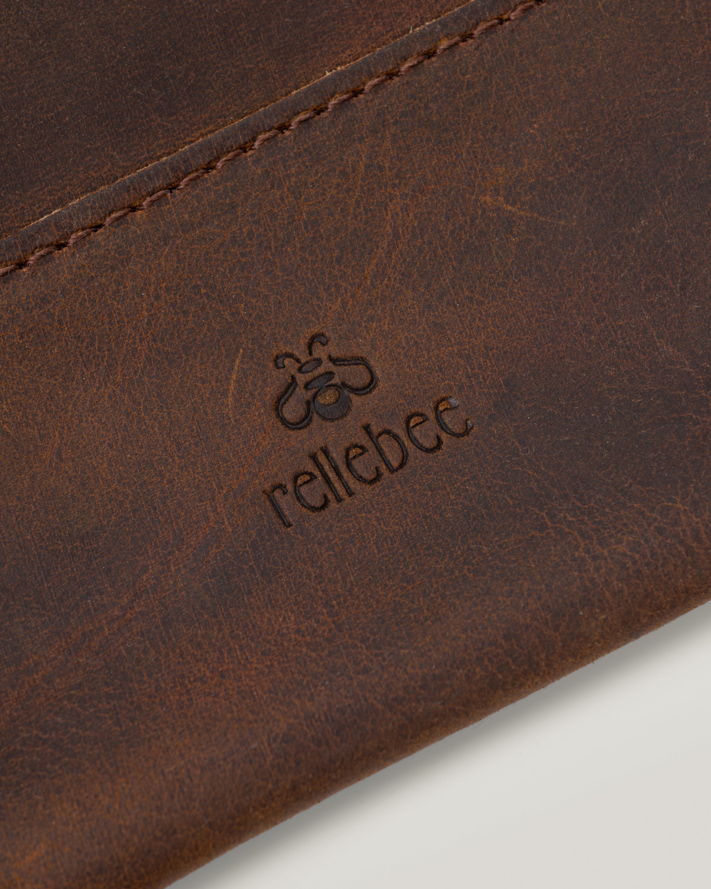 Closeup image of the Envelope sling showing the Rellebee logo