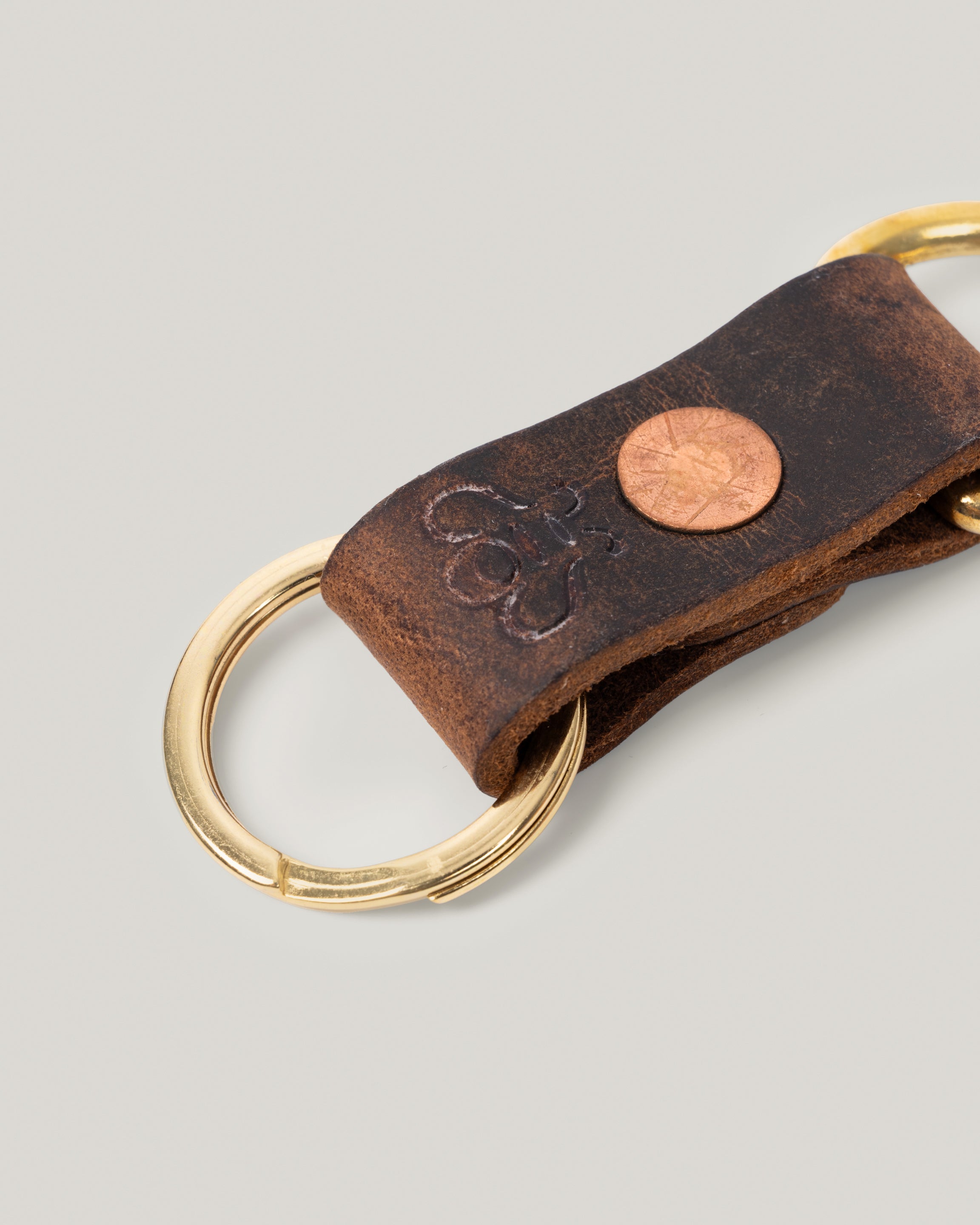 Closeup image of the Brass Key Ring in Crazy Horse Brown