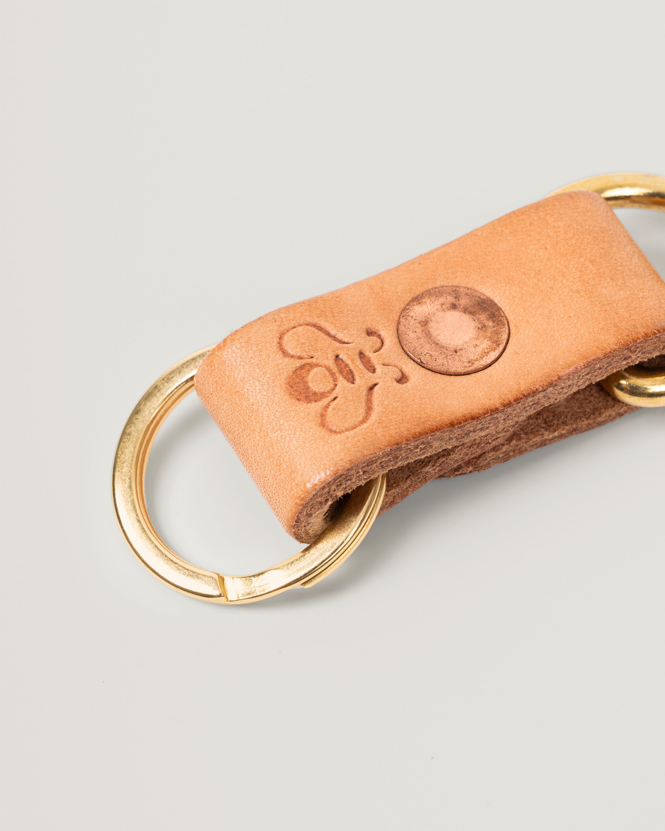 Closeup image of the Brass Key Ring in honey