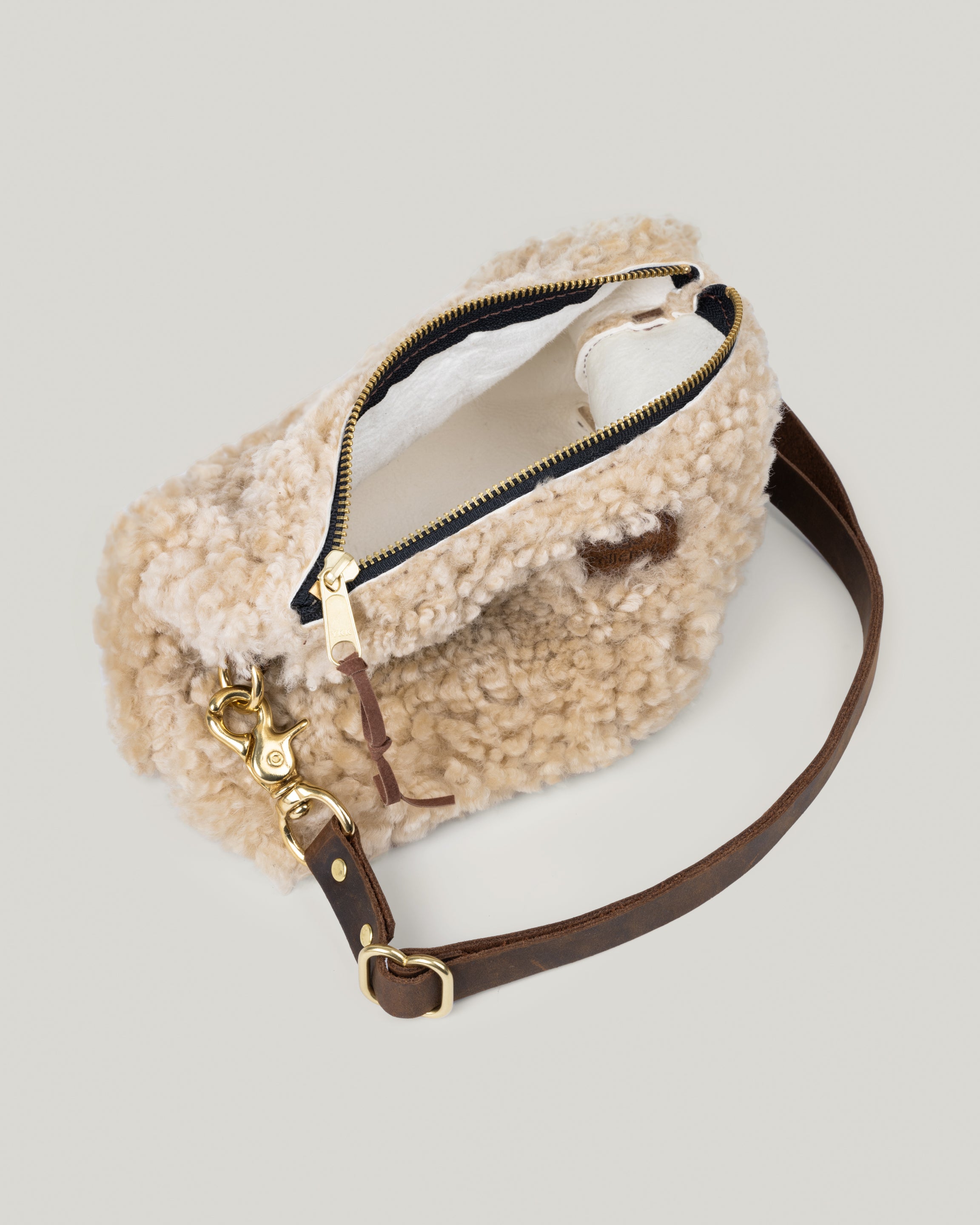 Image of the Little Brooklyn sling in Natural Shearling. Showing the inside of the bag