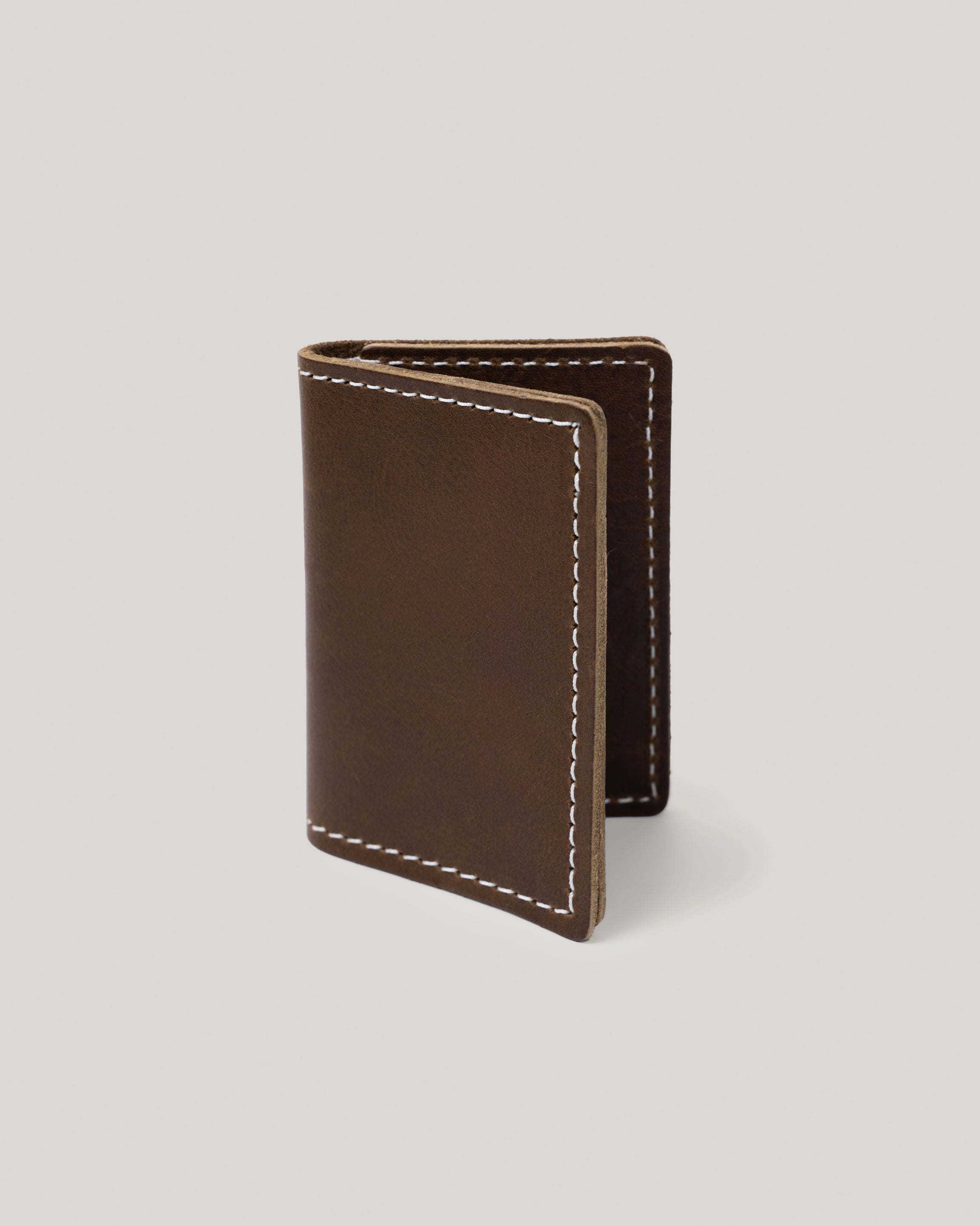Image of the product Minimalist wallet in smoke olive: It's really all you need. Slide a few credit cards, drivers license, insurance card and a few bills and you are good to go. This simple, minimalist, low profile wallet slides right into your back pocket. Unisex. No more bulk. 