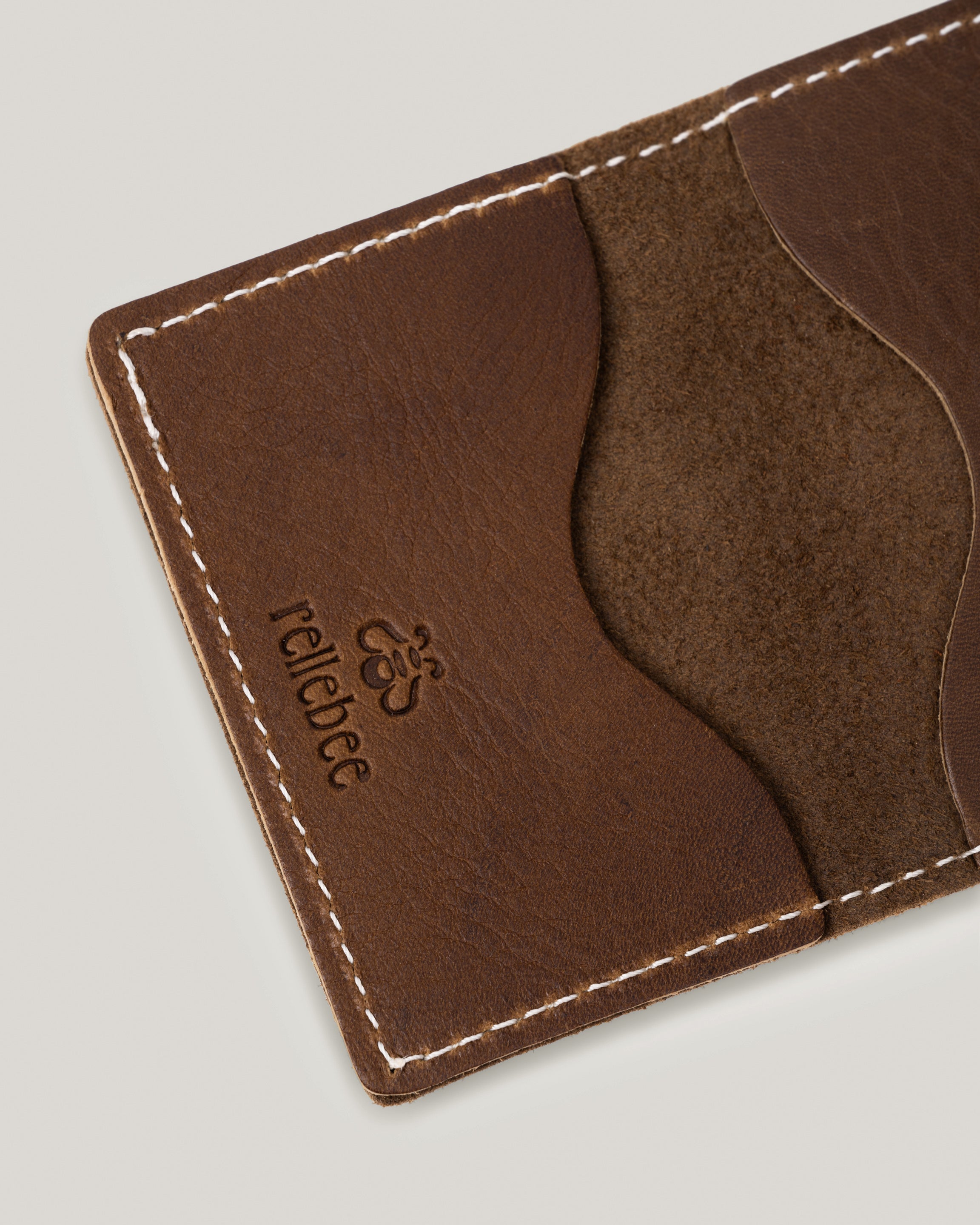 Close up view of the smoke olive minimalist wallet open showing the inside
