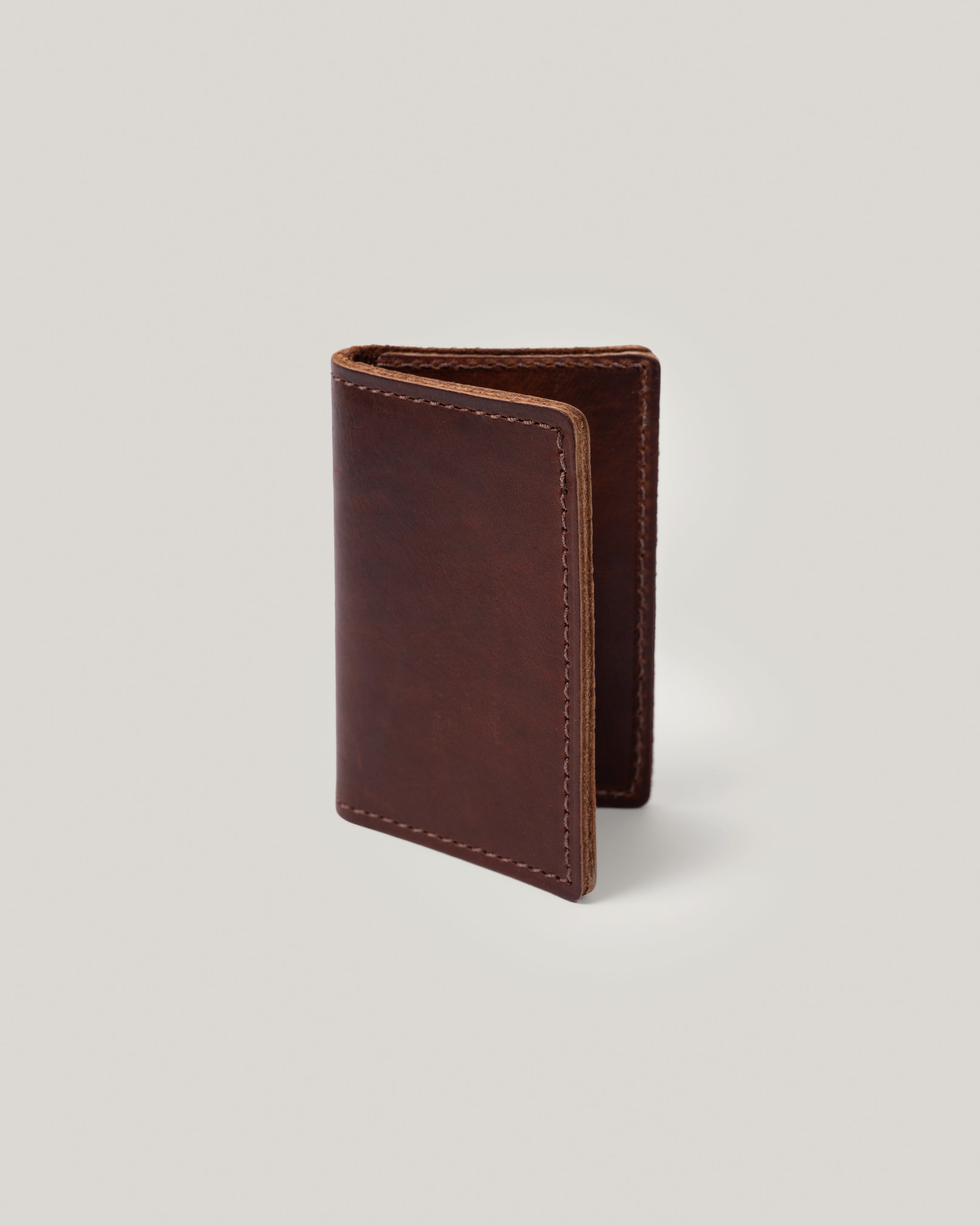 Image of the product Minimalist wallet in milk chocolate: It's really all you need. Slide a few credit cards, drivers license, insurance card and a few bills and you are good to go. This simple, minimalist, low profile wallet slides right into your back pocket. Unisex. No more bulk. 