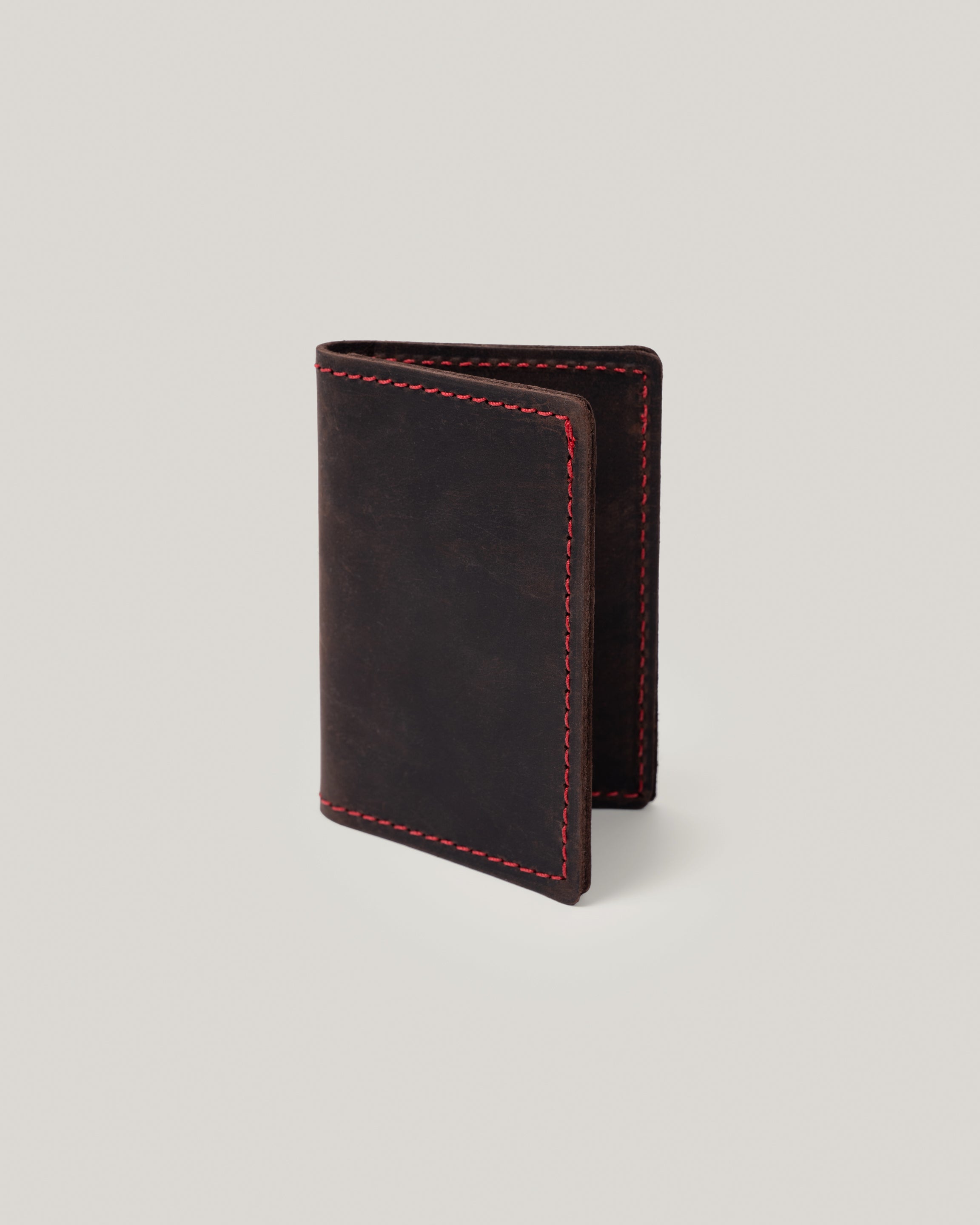 Image of the product Minimalist wallet in dark chocolate: It's really all you need. Slide a few credit cards, drivers license, insurance card and a few bills and you are good to go. This simple, minimalist, low profile wallet slides right into your back pocket. Unisex. No more bulk. 
