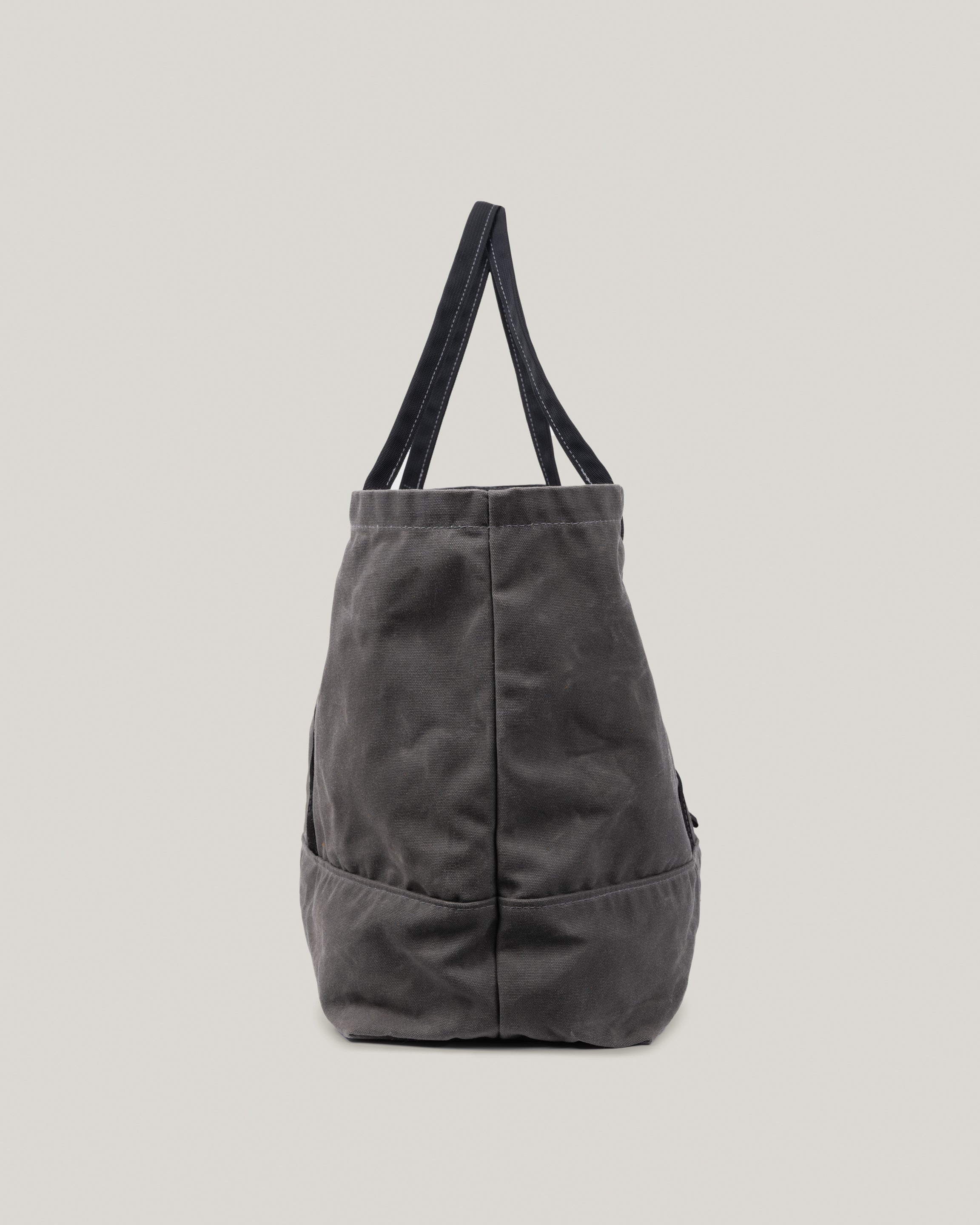 Side view image of the Utility Tote in charcoal waxed