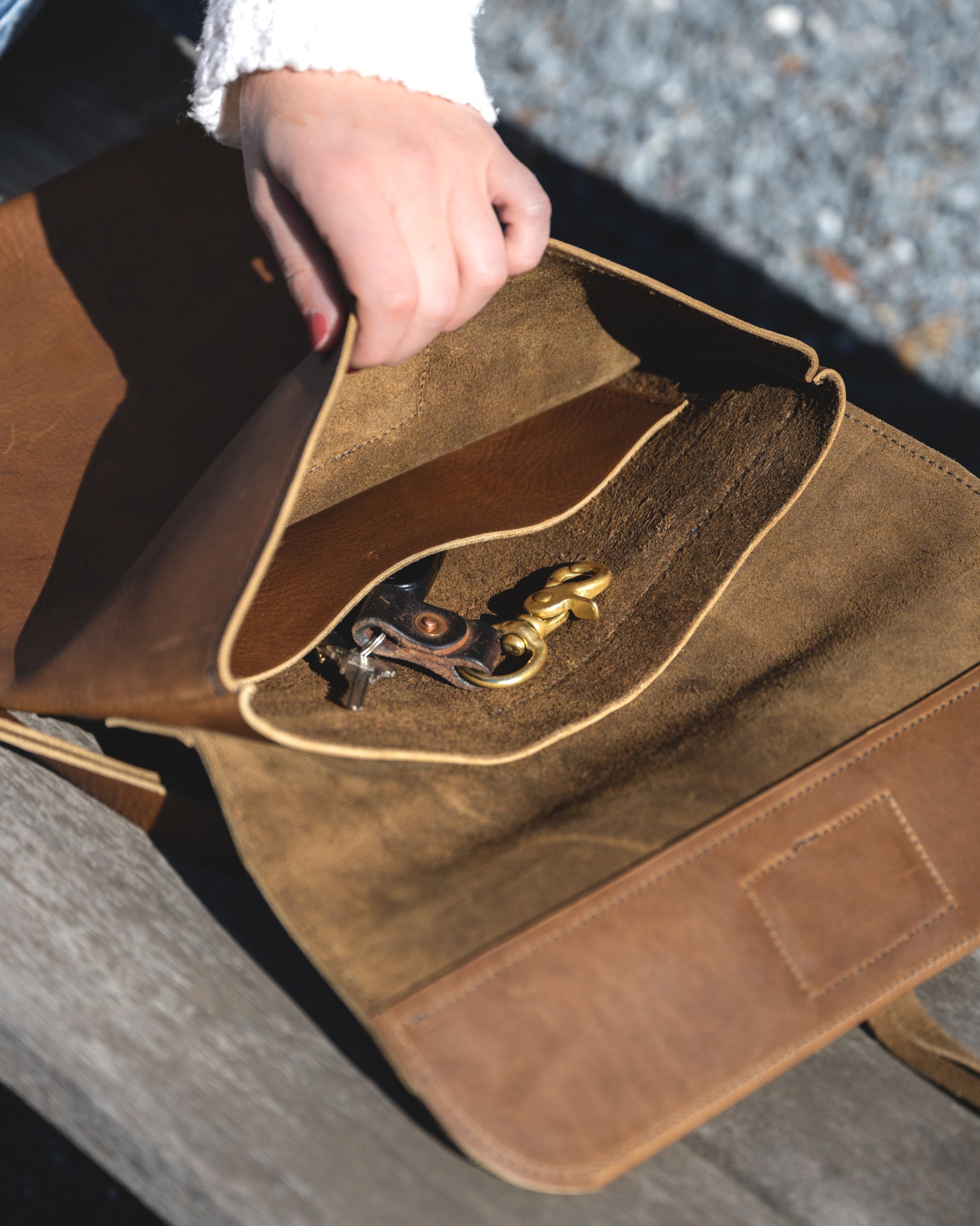 Close up view of the Messenger pack in Olive brown. Showing the interior compartments
