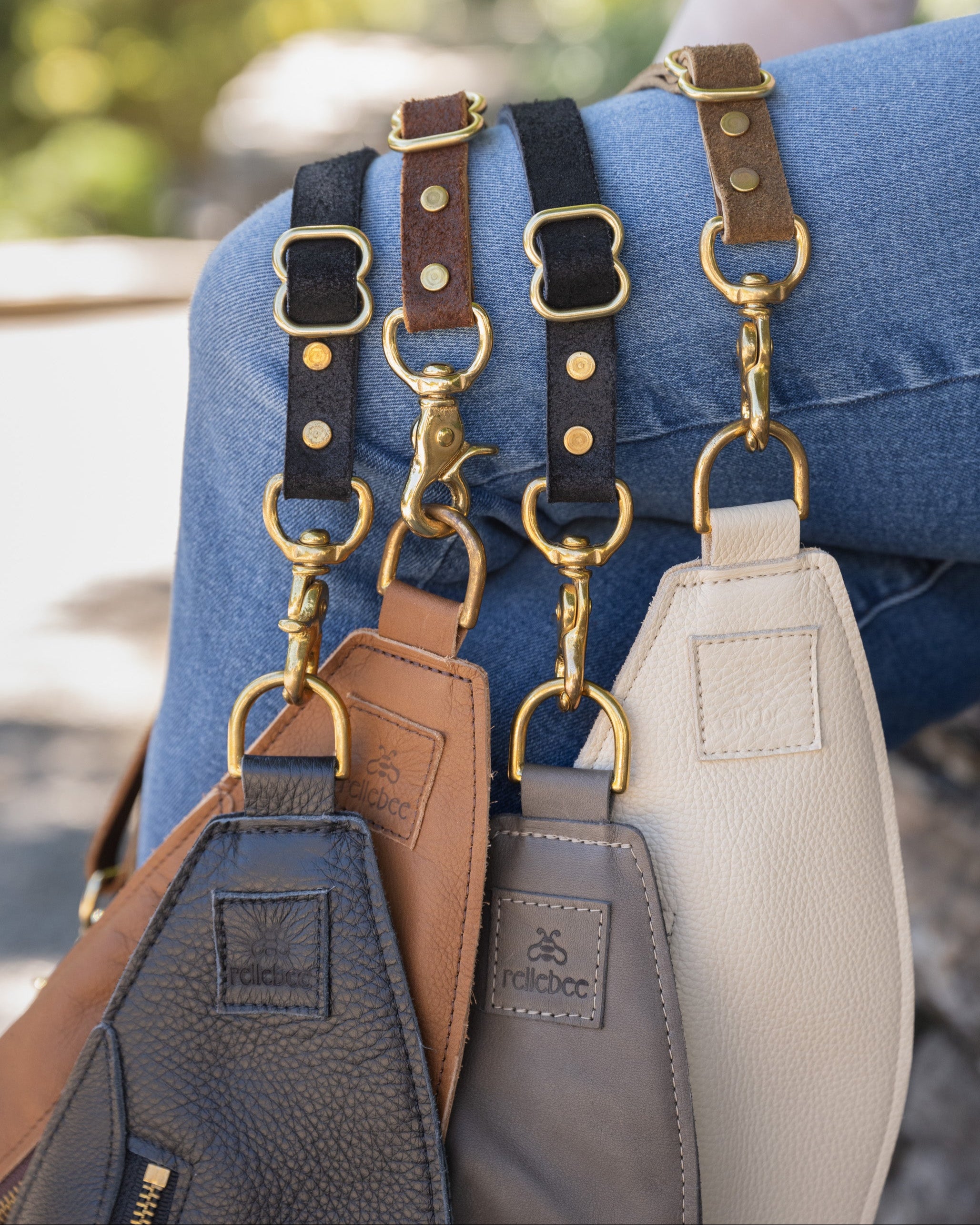 Image of model with 4 classic slings on their knees 