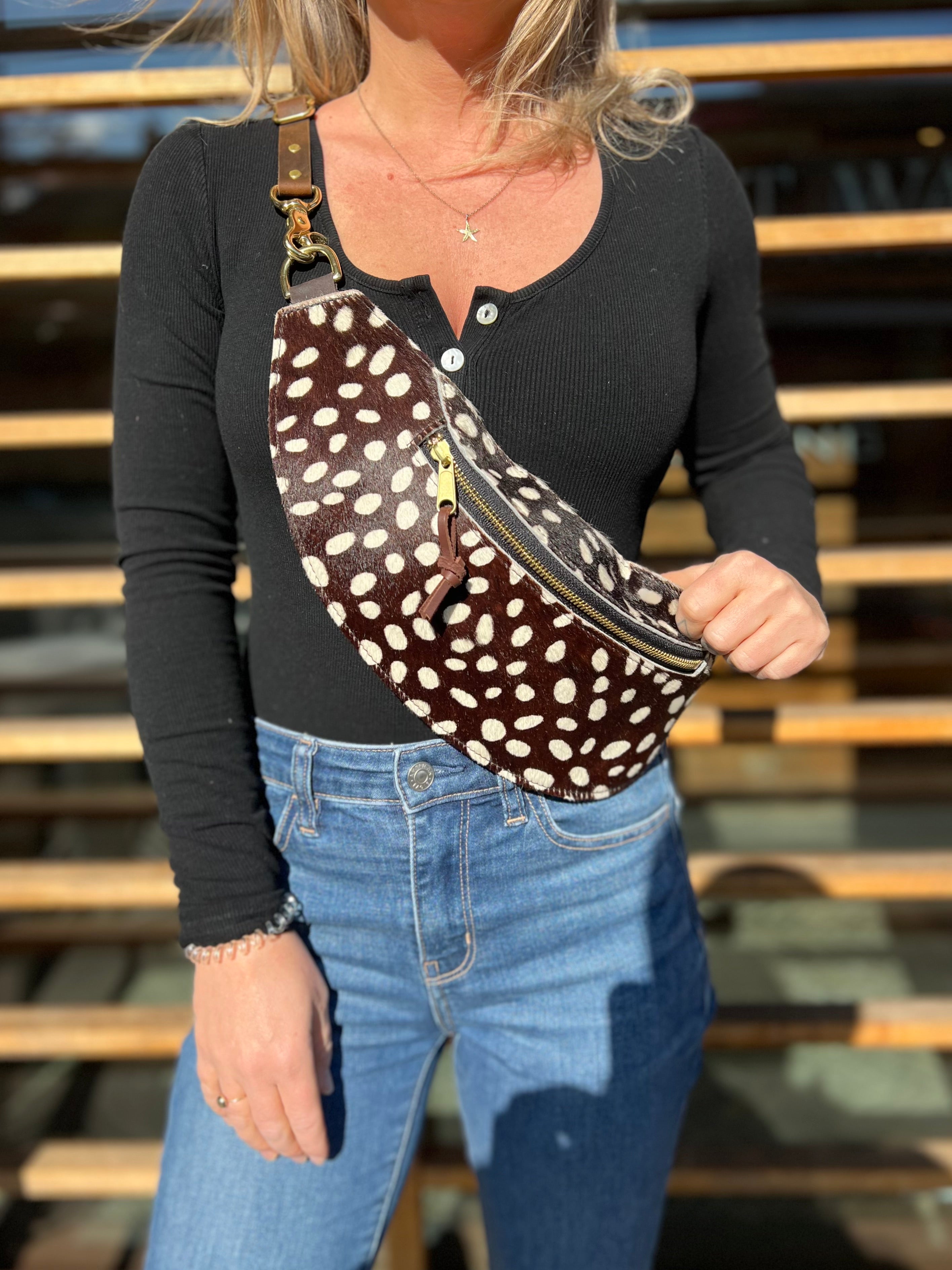 Image of model wearing the classic sling:Hair-on-hide in coco dot. 