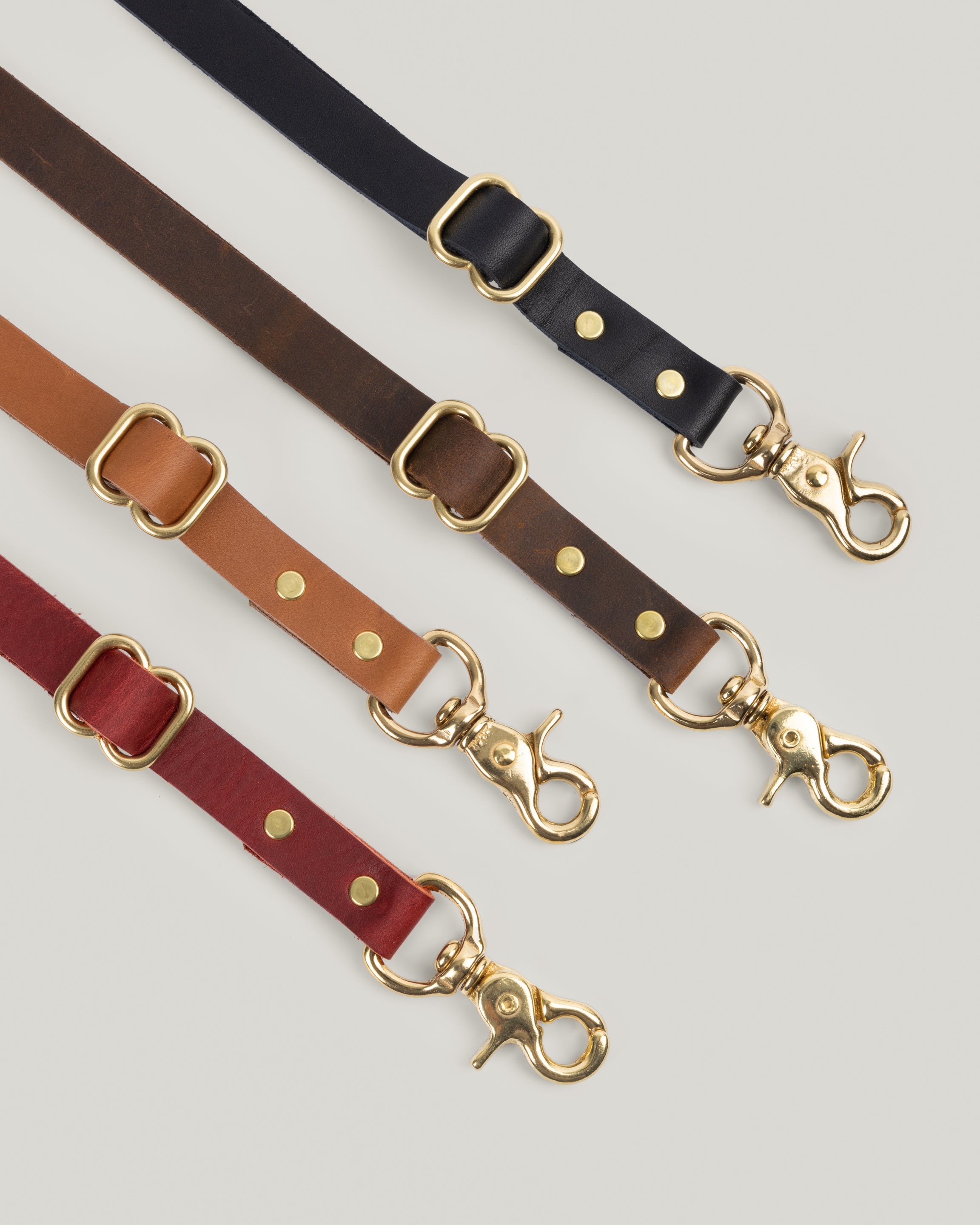 Image of the product Leather Bridle Straps in assorted colors.  These Bridle straps cannot be beat! Mix and match the Merlot, Honey, Black or Crazy Horse Brown with any of your Rellebee bags. 